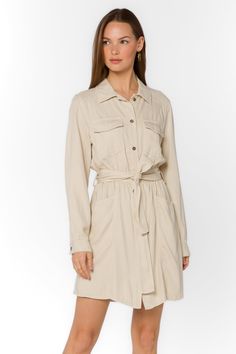 Add some sophistication to your wardrobe with the Deena Dress. This soft mini shirtdress features a stylish collar and snap button closure. With long sleeves and functional pockets, it's both practical and trendy. Complete the look with the self-belt for a flattering fit. Material: 60% Tencel™ and 40% Linen Machine wash cold or dry clean Color: Wheat Model is 5'9" and wearing a size S Imported Spring Collared Shirt Dress With Roll-up Sleeves, Classic Collared Shirt Dress For Day Out, Chic Long Sleeve Belted Dress For Fall, Chic Mini Dress With Pockets For Daywear, Long Sleeve Belted Cuffs Shirt Dress For Fall, Fall Fitted Shirt Dress With Tie Waist, Long Sleeve Dresses With Belted Cuffs, Chic Long-sleeve Shirt Dress With Belted Cuffs, Chic Long Sleeve Shirt Dress With Belted Cuffs