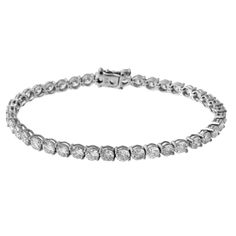 a white gold bracelet with round cut diamonds on the front and back side, set in 18k white gold