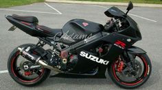 a black and red motorcycle parked in a parking lot