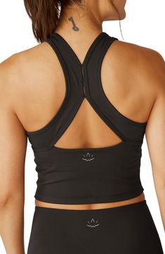 Superior stretch and comfortable support define this racerback tank made with an internal shelf bra that helps you focus on your next personal best. 15" length (size Medium) Partially lined Jewel neck Racerback 95% polyester, 5% elastane Machine wash, tumble dry Made in the USA of imported fabric