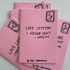 four pink envelopes with love letters written on the front and one in black ink