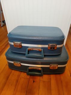 "Vintage Retro Hard Suitcase Luggage 1960s Blue 2 Pc Set, Nesting, Clean This beautiful, vintage luggage set features sleek lines, a vibrant blue color, and a lightweight, hard shell. The cases have chrome latches, swing handles and strong, chrome trim. Inside, the luggage has clean, near perfect quilted lining with a ruffled edge and a long pocket.  Small case has mirror that is in perfect condition-no marks or black images.   Measurements Large Case: 21\"L x 14.5\"W x 6\"D, Small Case: 17\"L x Vintage Luggage Set, Vintage Luggage With Luggage Sleeve For Trip, 70s Suitcase, Vintage Rectangular Luggage With Sleeve, Hard Suitcase, Vintage Train Case, 1940s Luggage Suitcases, Large Suitcase, Plush Backpack