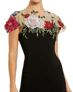 This gown features delicate floral embellishments on a figure-flattering jersey fabric. With its fitted silhouette, it exudes elegance and sophistication. Perfect for formal events or evening affairs. Mac Duggal Hand-embellished Mesh Bodice; Jersey Skirt (100% polyester) Partially lined bodice; fully lined skirt; semi-sheer unlined sleeves Round illusion high neckline Short sleeve Intricate floral detailing Concealed back zipper Approx. 62.5" from top of shoulder to bottom hem Available in Black Elegant Gown With Floral Applique For Gala, Elegant Floral Applique Gown For Gala, Floral Applique Floor-length Evening Dress For Party, Elegant Gown With Floral Embroidery For Gala, Elegant Gala Gown With Floral Embroidery, Elegant Floral Embroidered Gown For Gala, Elegant Floral Embellished Dress For Gala, Elegant Evening Gown With Floral Applique, Formal Floor-length Evening Dress With Floral Applique