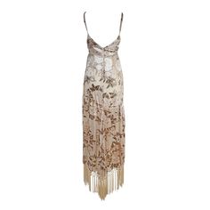 The Laurenia Fringe Faux Wrap Dress provides timeless elegance with its romantic velvet burnout fabric and fringe detailing. Ivory is complemented with earth tones for a look that is both feminine and modern. Perfect for formal occasions or an evening out. This item is a PREORDER and will ship in 2-3 weeks. Elegant Fringe Dress For Gala, Elegant Fitted Maxi Dress With Tassels, Elegant Fringe Dresses For Formal Occasions, Evening Silk Dresses With Fringe, Silk Evening Dresses With Fringe, Elegant Beige Tassel Dresses, Elegant Silk Dress With Fringe, Silk Fringe Evening Dresses, Luxury Fringe Formal Dress