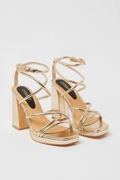 Introducing the Teddy Strappy Platform High Block Heeled Sandals! These stunning gold sandals are the perfect addition to any outfit. Designed for both style and comfort, these sandals feature a strappy design that adds a touch of elegance to your look. The high block heel provides a boost of height while ensuring stability and support. Whether you're heading to a special occasion or simply want to elevate your everyday style, these sandals are a must-have. Pair them with a skirt for a chic and feminine ensemble that will turn heads wherever you go. Step out in confidence and style with the Teddy Strappy Platform High Block Heeled Sandals. Grad Heels, Hoco Heels, Homecoming Heels, High Heels Prom, Hoco Shoes, Graduation Heels, Graduation Shoes, Homecoming Shoes, Cute Formal Dresses