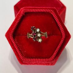 Stunning antique Victorian era 14k rosey gold genuine garnet and seed pearl ring! This gorgeous piece showcases three round cut genuine garnets with an estimated .33 ctw. with three seed pearls on the other side. An incredible piece of fine antique jewelry, circa 1800s!  ERA - Circa 1800 -Victorian  METAL / MATERIAL - 14k rosey gold, 3 genuine garnet ( approx. .33 ctw), 3 seed pearls  MARKINGS / HISTORY - NA CONDITION - Good antique condition. Ring has been cleaned and lightly polished. Surface wear and patina consistent with age remains. An amazing antique ring!  SIZE / MEASUREMENTS - Size: 6, Ring Head: 12.1 mm, Rise Of Ring Off Finger: 5.3 mm, Shank: tapers to 2.3 mm, Weight: 2.37 grams Victorian Rose Gold Ruby Ring, Vintage Garnet Cluster Ring As Gift, Vintage Garnet Birthstone Ring For Wedding, Victorian 14k Gold Cluster Ring With Gemstone, Antique Cluster Ring As A Gift, Victorian Ruby Ring Wedding Birthstone, Victorian Ruby Wedding Ring With Birthstone, Victorian 14k Gold Birthstone Ring, Victorian 14k Gold Birthstone Ring As A Gift