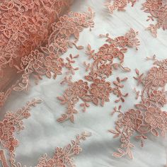 "Make any special occasion pop with our stunning Corded Bridal Lace Fabric Embroidered on 100% Polyester Net Mesh. This beautiful fabric is perfect for creating wedding dresses, evening gowns, and dance costumes that will be sure to make a lasting impression. Whether you're looking for a unique way to celebrate a quinceanera, an elegant bridal style, or a festive costume with a couture touch, our Corded lace fabric has the perfect combination of features to help bring your vision to life. Our Co Festive Ceremony Dress With Lace Work, Elegant Pink Fabric With 3d Embroidery, Festive Lace Embroidered Gown, Festive Floral Embroidered Lace Gown, Festive Embroidered Lace Gown, Pink Floral Embroidered Wedding Gown, Festive Lace Gown With Floral Embroidery, Festive Lace Gown With Embroidery, Wedding Dresses With 3d Embroidery And Lace