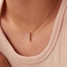 Discover the exquisite beauty of our Dainty Stainless Steel Zircon Pendant Necklace. This stunning piece features a mesmerizing zircon pendant that is meticulously inlaid in high-quality stainless steel. With its 18K PVD gold plating, this necklace exudes a luxurious and elegant appeal. The link chain adds a touch of sophistication, while the adjustable length of 15.5-17.5 inches ensures a perfect fit for every neckline. Elevate your style and make a statement with this captivating necklace, perfect for any occasion or as a thoughtful gift for someone special. Wedding Diamond Pendant Necklace With Delicate Chain, Dainty Diamond Necklace With Sparkling Stones For Anniversary, Dazzling Delicate Chain Necklace For Wedding, Elegant Crystal Necklace For Her, Dazzling Wedding Necklace With Delicate Chain, Cubic Zirconia Charm Necklaces For Weddings, Cubic Zirconia Charm Necklace For Weddings, Wedding Rhinestone Pendant Necklace With Clavicle Chain, Delicate Cubic Zirconia Diamond Necklace With Clavicle Chain