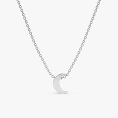 Luna Keep your dreams close with our dainty Mini Plain Gold Moon Pendant Necklace. This celestial charm features a solid 14k gold moon pendant with a touch of thickness for a dimensional look. The minimal design and polished gold finish create a timeless and versatile piece that complements any outfit. Crafted from high-quality 14k gold (available in yellow, white, or rose gold), this necklace offers long-lasting durability and a touch of luxury. - Handmade- Solid Gold- Size of Moon: 7 x 5 mm- The thickness of the Moon: 2 mm All pieces come beautifully boxed in suede pouches you can always use when traveling! Minimalist Charm Necklace With Round Pendant, Minimalist Everyday Necklace With Moon Charm, Minimalist Jewelry With Adjustable Half Moon Chain, Dainty Crescent White Gold Necklace, Minimalist Crescent Necklaces For Everyday, Minimalist Charm Necklace With Round Pendant And Polished Finish, Minimalist Jewelry With Moon Charm, Minimalist Everyday Necklaces With Moon Phase, Minimalist Half Moon Jewelry For Everyday