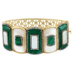 "18kt gold:43.924g, Diamond:1.79ct, Malachite:19.32ct, MOP:11.77ct" Size-58 x 48 mm Luxury Multi-stone Gold Bracelet, Luxury Gold Diamond Bracelet With Gemstones, Luxury Green Cuff Bracelet For Formal Occasions, Luxury Green Bangle, Luxury Gold Diamond Bracelet With Multi-stone, Luxury Green Gemstone Bangle, Luxury Yellow Gold Cuff Bracelet With Gemstone, Luxury Green Diamond Bracelet Hand Set, Luxury Multi-stone Diamond Bracelet