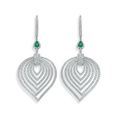 Crafted in 18K white gold, these earrings are pave set with 518 round brilliant cut diamonds. There's a pear shape emerald set that's fixed to the hoop. Pear-shaped Diamond Earrings With 17 Jewels, Pear-shaped Diamond Earrings With Accents, Elegant Teardrop Diamond Earrings Fine Jewelry, Teardrop Diamond Earrings With Elegant Design, Elegant Teardrop Diamond Cut Jewelry, Elegant Hand Set Teardrop Diamond Earrings, Elegant Hand-set Teardrop Diamond Earrings, Diamond White Pear-shaped Teardrop Earrings For Formal Occasions, Elegant Teardrop Diamond Jewelry