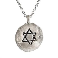 Description and Details Wear the Star of David close to your heart with this stunning, hand-sculpted pendant, which is imprinted with texture from stones of the Western Wall in Jerusalem. The sterling silver pendant hangs on a 16” traditional chain for a beautiful look that can be worn every day, or layered with your other favorite necklaces. Pendant 5/8″ (14mm) Sterling silver circle pendant Star of David engraving Imprint with texture from the stones of the Western Wall in Jerusalem Chain leng Jewish Necklace, The Star Of David, Large Pendant Necklace, Jewish Jewelry, Star Of David, Circle Pendant, Silver Pendant Necklace, Sterling Silver Necklace, Sterling Silver Pendant