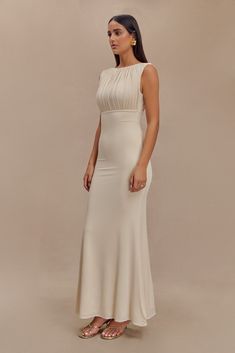 Understated glamour. The MALIA Slinky Ruched Maxi Dress is a masterclass in elegant design. Featuring a sophisticated boat neckline and daring open back, this bodycon dress flatters your silhouette with gathering detail at the bust. The fishtail hem adds a touch of drama, creating a graceful flow with every step. Fully lined for a smooth finish, Malia is the epitome of refined style. Capsule Wardrobe Accessories, Capsule Wardrobe Basics, Understated Glamour, European Summer Outfits, Ruched Maxi Dress, Wardrobe Accessories, Maxi Dress Sale, Capsule Outfits, Refined Style