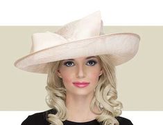 This soft gold Arbor hat is a modern take on the classic ladies hat. Get it here today along with many other elegant hats from Gold Coast Couture. Luxury Gold Wide Brim Hat, Formal Hat With Structured Crown For Royal Ascot, Royal Ascot Formal Hat With Structured Crown, Royal Ascot Structured Crown Formal Hat, Classic Formal Mini Hats With Wide Brim, Classic Party Hat With Flat Brim, Classic Wide Brim Mini Hat For Formal Occasions, Elegant Flat Brim Formal Hat, Elegant Mini Hat With Flat Brim For Formal Occasions