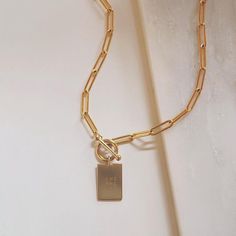 If you love a bold look, the Thick Dani necklace is for you. Personalize your pendant with a date, phrase, initials or keep it blank. (Up to 4 lines, 6 characters each line) We love the modern shape and minimalist design. Hangs along a chunky paperclip chain with a toggle clasp. DETAILS 14kt gold filled Engraving included: Up to 4 lines, 6 characters each line Choose necklace length Model wearing 18 inches Minimalist Personalized Link Necklace, Minimalist Necklace With Rectangular Links Gift, Minimalist Rectangular Link Necklace As Gift, Minimalist Rectangular Chain Necklace As Gift, Minimalist Rectangular Chain Necklace For Gifts, Minimalist Toggle Necklace With Cable Chain For Gift, Minimalist Rectangular Chain Necklace Gift, Elegant Personalized Necklace With Rectangular Links, Modern Everyday Necklace