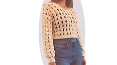 a woman is wearing a crochet sweater and denim pants with her hands in her pockets