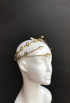 This truly luxurious headpiece made entirely by hand from delicate Italian gold leather. Ornately decorated with an array of beautiful floral appliqués and stunning Swarovski crystal and beads. Extremely light and comfortable to wear.  Looks amazing from any angle! Perfect wether you a wedding guest or a bride herself. Perfect accessory for New Years Eve party! Created for powerful goddess in mind.  Wear yours with confidence. Wedding Floral Crown, Boho Wedding Crown, Powerful Goddess, Halo Headpiece, Swarovski Tiara, Leather Crown, Floral Crown Wedding, Wedding Halo, Crystals Wedding