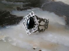 This beautiful sterling silver plated filigree ring has a sterling silver plated filigree setting with black obsidian stone. Adjustable. Gothic Formal Adjustable Rings, Gothic Style Adjustable Rings For Formal Occasions, Gothic Adjustable Rings For Formal Occasion, Adjustable Gothic Style Rings For Formal Occasions, Antique Silver Adjustable Victorian Ring, Adjustable Antique Silver Victorian Ring, Ornate Metal Rings For Gifts, Ornate Metal Rings As Gift, Ornate Metal Rings For Gift