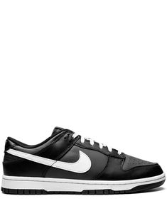 Dunk Low Retro sneakers from NIKE featuring black, leather, signature Swoosh logo detail, embroidered logo to the rear, round toe, front lace-up fastening, logo patch at the tongue, branded insole and rubber sole. These styles are supplied by a premium sneaker marketplace. Stocking only the most sought-after footwear, they source and curate some of the most hard to find sneakers from around the world.. | Nike Dunk Low Retro sneakers Black Dunks, Panda Sneakers, Nike Dunks Low, Dunks Low, Dr Shoes, Retro Sneakers, Swoosh Logo, Nike Dunk Low, Nike Cortez Sneaker