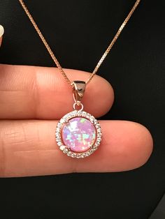 "Rose Gold Pink Fire Opal and CZ Necklace Bridal Opal Necklace / October Birthstone Necklace Metal: All Components Are Made From 14k Rose Gold Plated (vermeil) Sterling Silver Stone: 10mm Lab created Opal and Cubic Zirconia Measurement: pendant height is 21mm (0.83\") including bail and 13mm (0.51\") wide Choose Chain Length At Checkout Please feel free to Convo me with any questions before purchasing. Please view policy before purchasing Other Opal Necklaces can be found here https://www.etsy.c Luxury Pink Opal Elegant Necklace, Rose Gold Crystal Necklaces For Formal Occasions, Sparkling Rose Gold Cubic Zirconia Necklace, Rose Gold Cubic Zirconia Round Necklace, Rose Gold Crystal Necklace With Sparkling Stones, Rose Gold Cubic Zirconia Necklace, Sparkling Gold Bridal Necklace, Sparkling Gold Bridal Necklace As Gift, Dazzling Sparkling Pink Jewelry