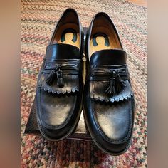 Nunn Bush Men's Leather Loafers, Black, Size 12. Gently Used. Classic Black Slip-on Tassel Loafers, Black Round Toe Tassel Loafers For Business, Black Wingtip Slip-ons For Semi-formal Occasions, Black Cap Toe Semi-formal Loafers, Casual Black Slip-on Tassel Loafers, Black Wingtip Loafers With Leather Footbed, Black Moc Toe Tassel Loafers With Rubber Sole, Black Slip-on Tassel Loafers With Rubber Sole, Black Tassel Loafers With Rubber Sole And Moc Toe