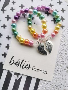 "Rainbow pearl best friends bracelet, heart charms, friendship, besties, classmate gift, kids bracelet. One SET of TWO bracelets. Friendship bracelets, for your magical best friend. this listing is for TWO (2) bracelets. When checking out, let us know the following: 1) colour scheme you would like  DETAILS and MEASUREMENTS: Beads vary in sizes from 6mm-10mm. The length of a bracelet is 6.5\" (we can make them smaller or bigger for you). You may also check our Social Media pages, if you are looki Multicolor Friendship Bracelets For Valentine's Day, Heart-shaped Hypoallergenic Charm Bracelet For Friendship, Hypoallergenic Heart-shaped Charm Bracelet For Friendship, Cute Beaded Bracelets For Valentine's Day Friendship, Cute Beaded Bracelets For Valentine's Day, Multicolor Heart Charm Bracelet For Friendship, Mother's Day Friendship Beaded Bracelet With Heart Charm, Heart Charm Bracelet For Friendship And Mother's Day, Heart-shaped Friendship Bracelets For Mother's Day