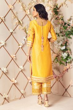 A Festive Jacquard Silk net ensemble in beautiful yellow hue featuring floral embroidery in multi colors, embellished in gota along with dabka, sequins, stones and pearls.Gota embellished hand block printed borders to enhance look. This stunning kurta is paired with jamawar culottes with gota embellished border and Shimmer net dupatta embellished with dhanak, sequins, block printed border and gota florals, tassels at back, making it a perfect choice for Mehendi, mayun and other wedding festiviti Boutique Suits, Designer Outfit, Master Card, Pakistani Designers, Net Dupatta, Full Sleeve, Floral Embroidery, Block Print, Borders