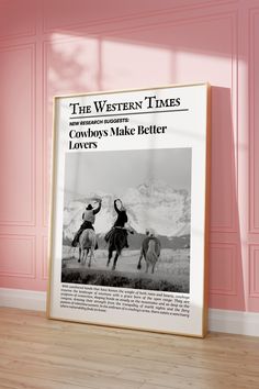 the western times cowboy's make better letters poster in front of a pink wall