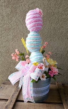 a basket filled with lots of cake and flowers