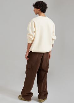 Color: Cream Midweight wool blend knit Relaxed fit Crew neckline Drop shoulders Elasticated hem and cuffs Ribbed trim Unlined 57% Acrylic 20% Wool 20% Polyamide 3% Polyurethane Dry Clean By The Frankie Shop. Imported Wool Crew Sweater With Ribbed Cuffs, Winter Beige Sweatshirt With Ribbed Cuffs, Beige Crew Neck Winter Sweatshirt, Beige Winter Sweatshirt With Ribbed Cuffs, Beige Crew Neck Sweatshirt For Winter, Beige Crew Sweatshirt For Winter, Casual Wool Sweatshirt With Ribbed Cuffs, Cream Sweatshirt With Ribbed Cuffs For Winter, Relaxed Fit Wool Tops With Ribbed Cuffs