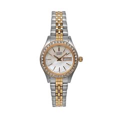 A crystal-accented bezel and mother-of-pearl dial make this women's stainless steel watch from Citizen a lovely way to infuse feminine charm into any ensemble. Comes in a gift box.FEATURES Calendar: day & date Water resistance: 30 meters Made with Swarovski Elements CASE & DISPLAY Mother-of-pearl dial Gold-tone hands & markers Face cover: mineral crystal Case & caseback: stainless steel Stones: crystal 26-mm diameter BAND Stainless steel Fold-over pushbutton deployment clasp Wome Stainless Steel Watch Women, Calendar Day, Two Tone Watch, Steel Watch, Stainless Steel Watch, Minerals Crystals, Face Cover, Quartz Movement, Mother Of Pearl