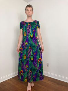 ERA - 1970s  LABEL - No makers label (likely handmade)   TYPE - Dress COLOR - Multi  FEATURES - Crazy good dress! I love this print - it is so wild! Large-scale peacock feathers in groovy psychedelic colors. There is even a super intense dayglo pink in the mix. So Trippy. The dress features a metal hidden zip closure at the back. There are bust and waist darts for shape. The textile is lightweight with a barkcloth texture. Such a great vintage dress - would make an epic dress for tiki events, resort wear, and summer parties  MATERIAL - Acrylic    CONDITION - Excellent   MEASUREMENTS  Shoulders - 15.5" Bust - 38"  Waist - 33" The waist was measured 15.25" down from the shoulder point Hips - 44" Length - 55.5" Arm opening - 8" flat across  All items are vintage and may show natural signs of Good Dress, Peacock Print, Peacock Feathers, Summer Parties, Dress Clothes For Women, Vintage Dress, Resort Wear, Vintage Dresses, Nice Dresses