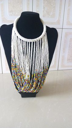 ON SALE Multistrand Beaded Necklace, African Beaded Jewelry, White Beaded Necklace, Tribal Jewelry, White Multi-strand Necklace With Large Beads, White Beaded Festival Choker Necklace, White Bohemian Choker With Colorful Beads, White Beaded Bohemian Choker, White Bohemian Beaded Choker, Adjustable White Necklaces With Dangling Beads, White Multi-strand Beaded Necklaces, White Adjustable Necklace With Dangling Beads, White Multi-strand Beaded Necklace