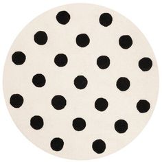 a black and white polka dot rug on a white background