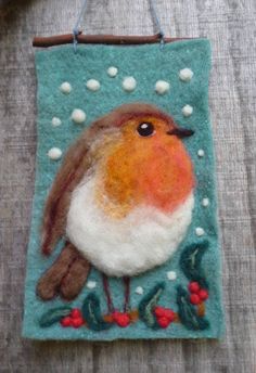 a felt ornament with a bird on it