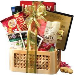 a basket filled with lots of different types of food and snacks in front of a white background