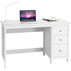 a white desk with a laptop on it