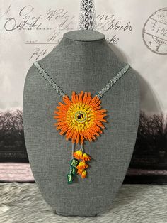 Beautiful set of necklace, bracelet and earrings, handmade by Mexican artisans. Handmade Adjustable Orange Necklace, Adjustable Handmade Orange Necklaces, Handmade Unique Orange Necklaces, Unique Handmade Orange Necklaces, Orange Beaded Flower-shaped Jewelry, Orange Beaded Flower Jewelry, Orange Flower-shaped Beaded Jewelry, Handmade Pendant Beads For Gifts, Artisan Orange Necklaces For Crafting