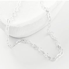 this silver chain can be worn alone as a simple, subtle statement or as a layering piece. White Link Necklace With Silver Chain, Silver Cable Chain Link Necklace, Simple Silver Delicate Chain Necklace, Simple Silver Chain Necklace As Gift, Simple Silver Chain Necklace Gift, Minimalist Silver Necklace With Oval Link, Minimalist Silver Oval Link Necklace, Minimalist Silver Chain Necklace For Everyday, Everyday Sterling Silver Charm Necklaces