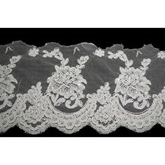 white lace with flowers on black background