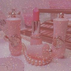 a pink vanity set with pearls on the table