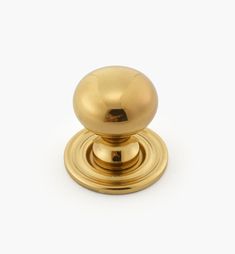 an antique brass door knob on a white background