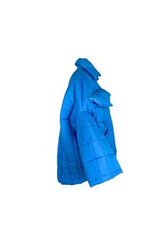 Unisex quilted jacket "Lupinus Blue" features a round shoulder and oversized fit for a relaxed, comfortable feel. It's made from lightweight, wrinkle-free polyester and has large pockets, windproof, and water repellent properties. The soft, bold shape makes it a statement piece, and the hypoallergenic synthetic padding adds warmth without compromising style.Size Guide:ONE SIZE (fits to XS-XL)Collar - 51 cmWides middle line - 170 cmBottom line - 140 cmSleeve ends - 57 cmLength from the neckline t Oversized Puffer Outerwear For Outdoor Activities, Oversized Nylon Puffer Jacket With Pockets, Oversized Casual Puffer Jacket With Pockets, Casual Oversized Puffer Jacket With Pockets, Oversized Quilted Nylon Outerwear, Oversized Outdoor Puffer Jacket With Pockets, Oversized Puffer Jacket With Pockets For Outdoor, Outdoor Nylon Quilted Jacket With Pockets, Outdoor Quilted Nylon Jacket With Pockets