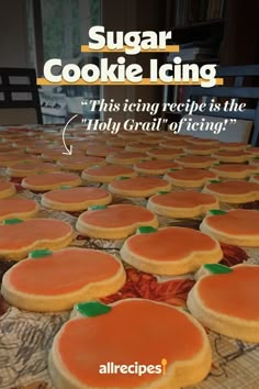 an advertisement for sugar cookie icing with oranges on top and green leaves in the middle