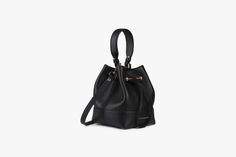 Handcrafted to a soft structure from buttery soft pebbled finish leather, the Lana Osette features an elegant drawstring closure completed with the Strathberry signature bar. In a new take on a classic bucket bag silhouette, this versatile and compact daywear bag features both a top handle and a longer strap, allowing it to be carried crossbody or in the hand. Leather Bucket Bag With Detachable Handle For Everyday, Chic Evening Bucket Bag With Removable Pouch, Modern Evening Bucket Bag Pouch, Luxury Leather Bucket Bag With Leather Handles, Elegant Bucket Shoulder Bag For Everyday Use, Chic Formal Hobo Bag In Soft Leather, Versatile Bucket Bag For Evening, Chic Formal Hobo Bag With Soft Leather, Elegant Evening Bucket Bag With Leather Handles