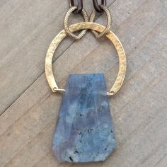 This mixed metal necklace has a gorgeous Labradorite gemstone as a focal and when it hits the light, has a rainbow of colors that flows though it. A mixture of textures are combined in this beauty. Hammered brass drop that attaches to brass textured rings and elongated darkened brass chain. Matte gold hardware ties is all together. Labradorite gemstone Hammered brass half circle drop Brass texture rings Antiqued brass elongated chain Matte gold lobster clasp Length 20" Pendant length 1.75" Creat Mixed Metal Necklace, Brass Texture, Hammered Brass, Labradorite Necklace, Metal Necklace, Textured Ring, Labradorite Necklaces, Wilmington Nc, Half Circle