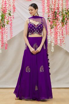 Purple crepe kalidar embroidered lehenga with side tie-up tassels. Comes with embroidered blouse and scallop hem dupatta.
Component: 3
Pattern: Embroidered
Type Of Work: Bead work
Neckline: Sweetheart
Sleeve Type: Sleeveless
Fabric: Blouse and Lehenga:Crepe; Dupatta:Soft Net
Color: Purple
Other Details: 
Side tassel tie-up lehenga
Occasion: Sangeet - Aza Fashions Bead Work Blouse, Embroidered Lehenga, Scallop Hem, Purple Blouse, Fashion App, Scalloped Hem, Work Blouse, Embroidered Blouse, Set For Women