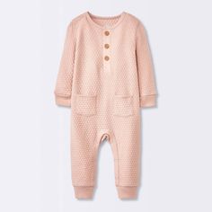 Keep your little one nice and cozy by dressing them up in the Sweater Romper from cloud island™. This Henley romper is made from 100% cotton fabric to offer soft and breathable comfort all day long. This pink sweater romper features jacquard-knit detailing for texture and artistic style. The front pockets add to the look, while the ribbed cuffs and hem offer a snug fit. Designed with a Henley neckline, this long-sleeve romper includes front buttons and crotch snaps for quick and easy dressing an Playful Long-sleeve Bubble Romper For Loungewear, Playful Long Sleeve Bubble Romper For Loungewear, Playful Long Sleeve Bubble Romper For Playwear, Playful Pink Long Sleeve Jumpsuits And Rompers, Playful Long Sleeve Pink Jumpsuits And Rompers, Cotton Long Sleeve Jumpsuits And Rompers For Playwear, Pink Long Sleeve Jumpsuits And Rompers For Playtime, Winter Cotton Bubble Romper With Long Sleeves, Solid Long Sleeve Onesie For Bedtime