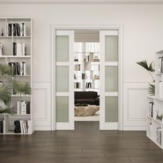 an empty living room with bookshelves and plants