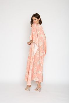 Printed Long Caftan Can be worn loose or cinched at the waist Comes with a matching belt as an option for styling Lusciously soft poly-silk blend for ease of care Machine wash cool Tumble-dry low Spring Loungewear Wrap Kaftan, Tie Waist Kimono For Loungewear, Spring Kaftan With Kimono Sleeves For Loungewear, Spring Loungewear Kaftan With Kimono Sleeves, Flowy Tunic Kimono For Loungewear, Pink Maxi Length Kimono For Spring, Spring Maxi Dress For Lounging, Spring Maxi Length Robe For Loungewear, Spring Rayon Kaftan With Kimono Sleeves